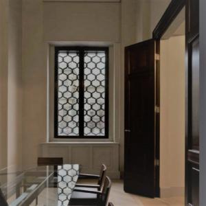 steel framed window with decorative grating 