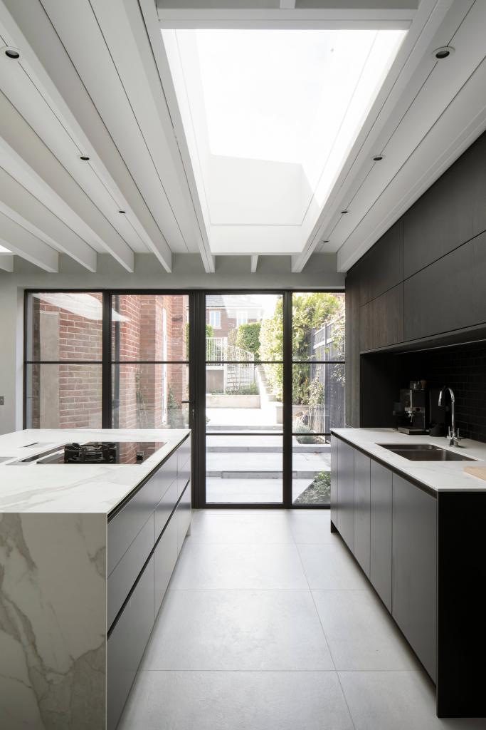 Modern kitchen with steel patio doors and rooflight