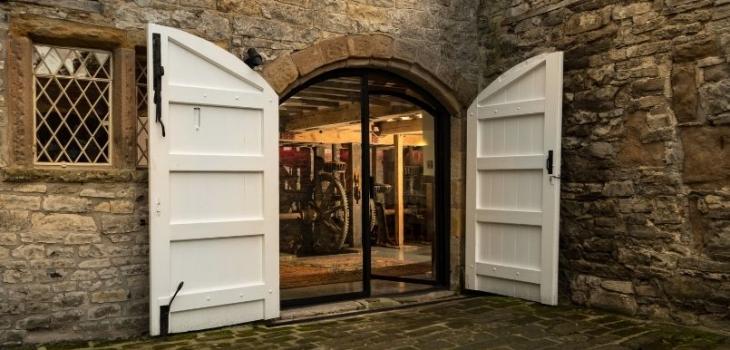 Arched steel exterior door on farm house